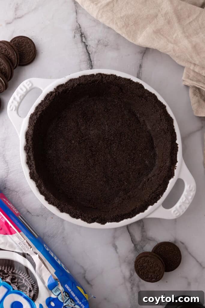 Oreo Pie Crust Recipe showing crushed Oreos and melted butter
