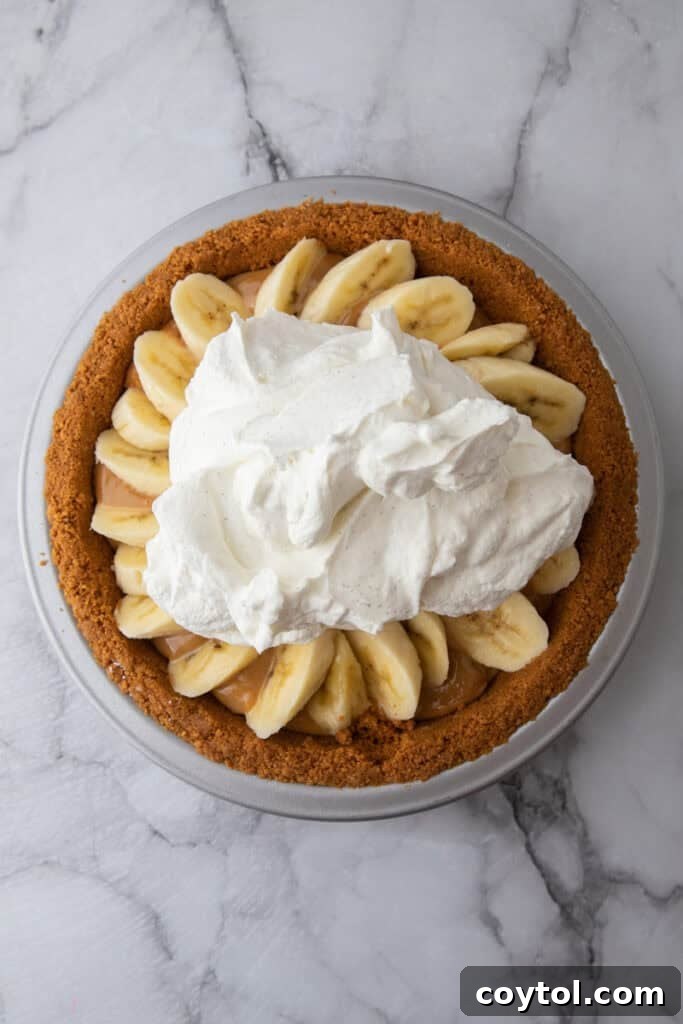 The Secret To Divine Banoffee Pie 11 whipped cream on top of other ingredients