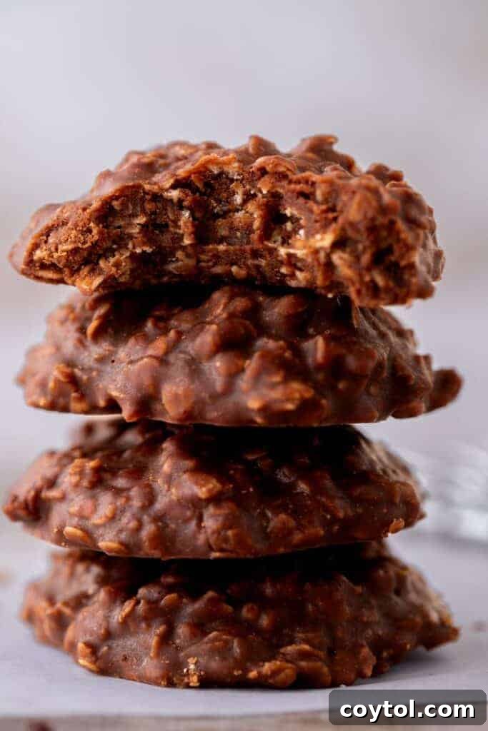 A stack of perfectly formed no-bake chocolate oatmeal cookies, ready to be enjoyed.