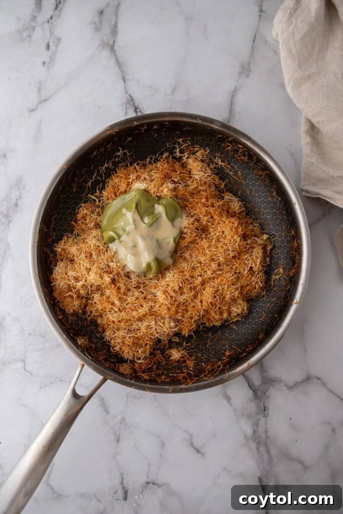 Golden brown and crispy toasted kataifi in a pan.