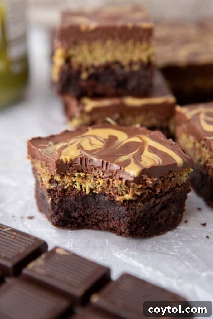 A sliced Dubai Chocolate Brownie showing the distinct layers of brownie, kataifi, and chocolate.