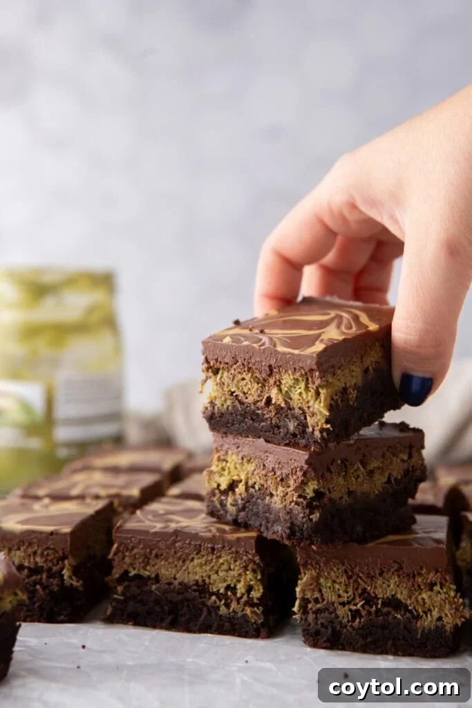 Several Dubai Chocolate Brownies stacked artfully on top of each other.