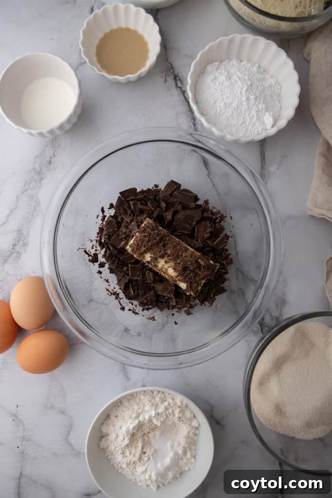 Butter, chocolate, and oil in a bowl, ready to be melted.