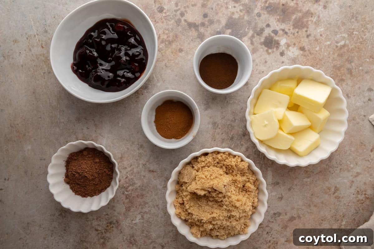 Cherry chocolate cinnamon roll filling ingredients with butter, brown sugar, cocoa, and cherries