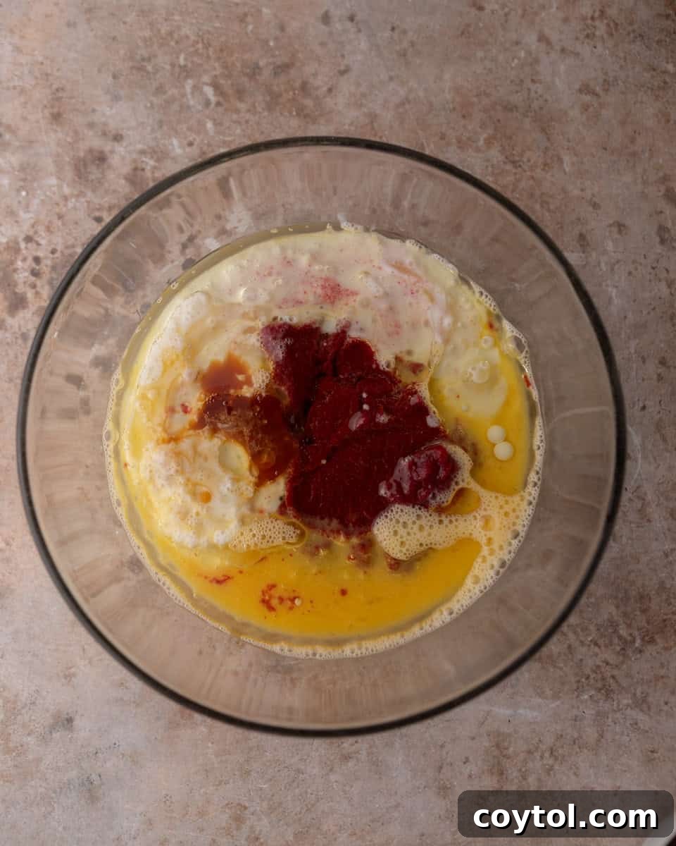 Wet cake ingredients combined in a bowl before mixing