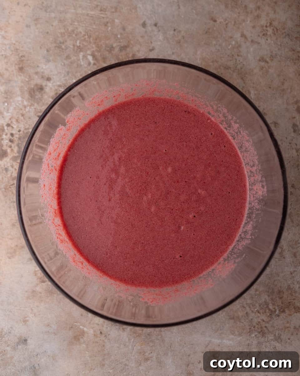 Cooked beets blended into a smooth puree in a bowl