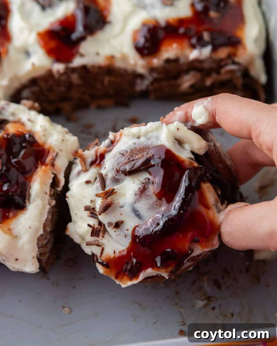 Black Forest cinnamon roll with cherry filling and mascarpone frosting