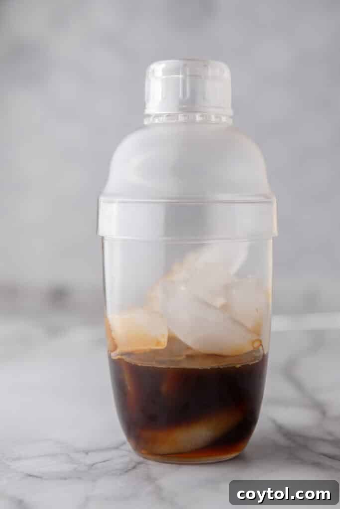 Unlock Starbucks Flavors: 65+ Beloved Recipes You Can Make 5 Espresso and ice in a cocktail shaker before making a homemade Starbucks shaken espresso
