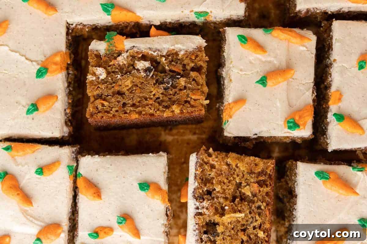 Effortless Easter Treats: Over 20 Recipes for a Memorable Spring Feast 5 Moist carrot cake sheet cake cut into squares with cream cheese frosting and piped carrot decorations in a 9 by 13 pan