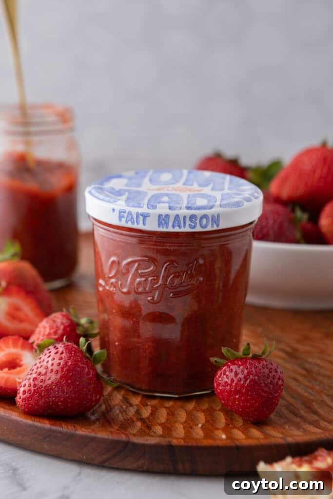Effortless Easter Treats: Over 20 Recipes for a Memorable Spring Feast 8 Homemade strawberry rhubarb jam in a Le Parfait glass jar on a wooden board surrounded by fresh strawberries