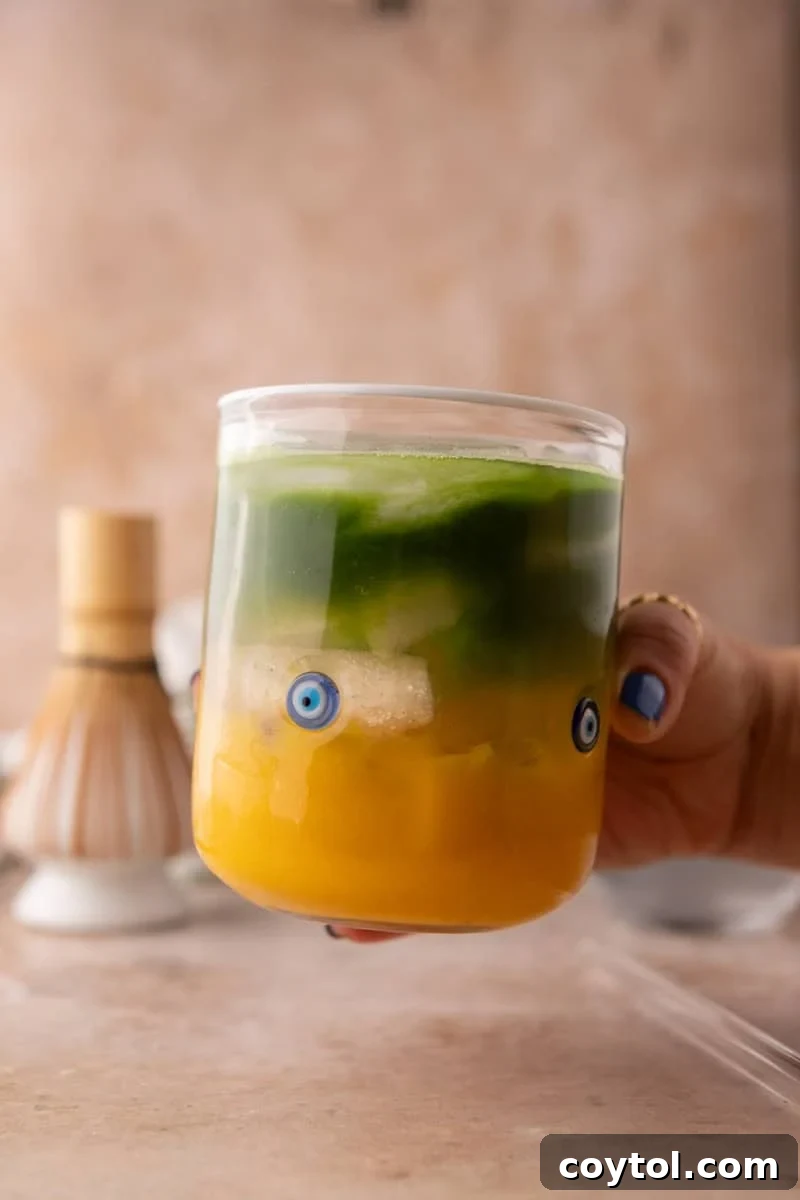 Fresh Mango Matcha Coconut Water Delight 2 layered mango matcha drink with coconut water showing vibrant yellow mango and green matcha
