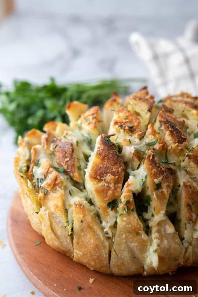 Golden Gooey Garlic Bread Pull Apart Perfection 4 Perfectly baked garlic cheese bread made with a crusty sourdough loaf, golden brown and bubbling with melted cheese.