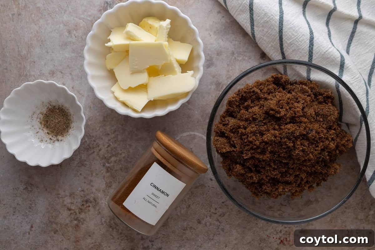Ingredients for the cinnamon roll filling are displayed, including softened butter, light brown sugar, ground cinnamon, and ground cardamom.