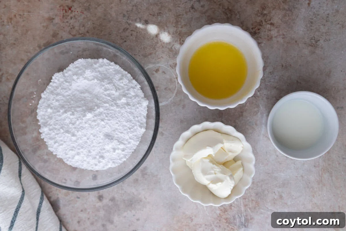 The ingredients for the cream cheese glaze are arranged on a surface: powdered sugar, melted butter, softened cream cheese, and milk.