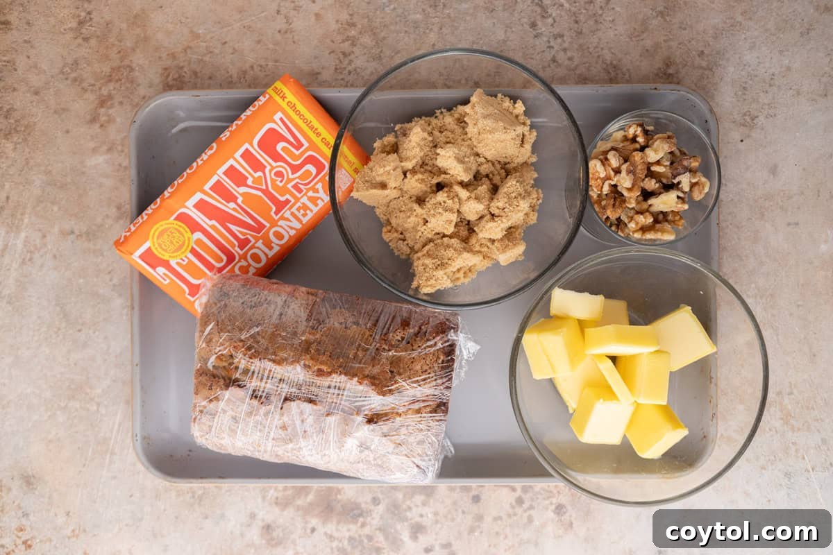  Ingredients for banana bread Christmas crack including Tony's Chocolonely, brown sugar, butter, walnuts, and banana bread.
