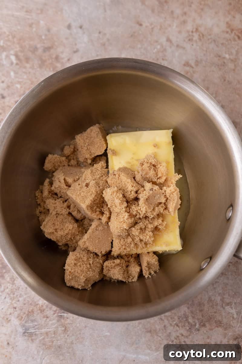 Unsalted butter and light brown sugar in a saucepan before making toffee for croissant crack
