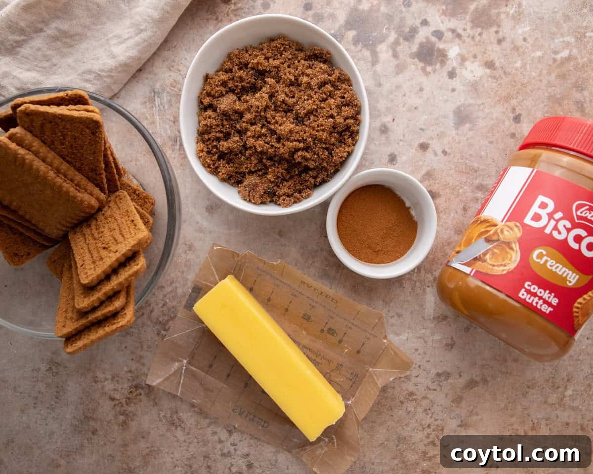 Cookie butter filling ingredients with Biscoff cookies, brown sugar, cinnamon, butter and a Lotus jar