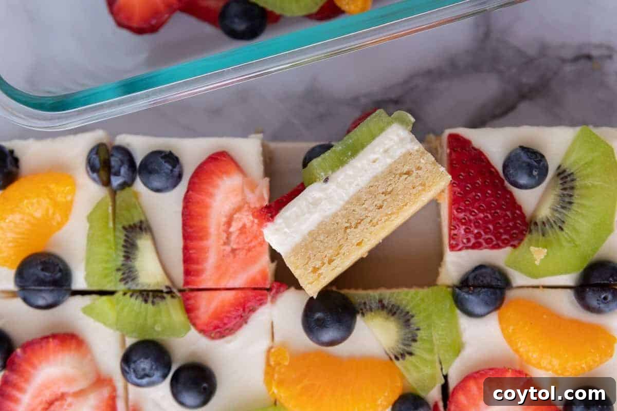Patriotic fruit pizza bars, an easy 4th of July dessert topped with berries.