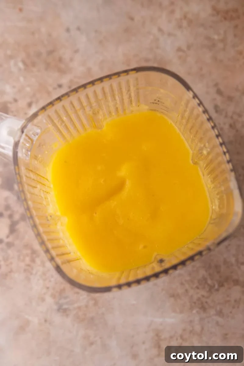 Smooth blended fruit puree in a blender jar