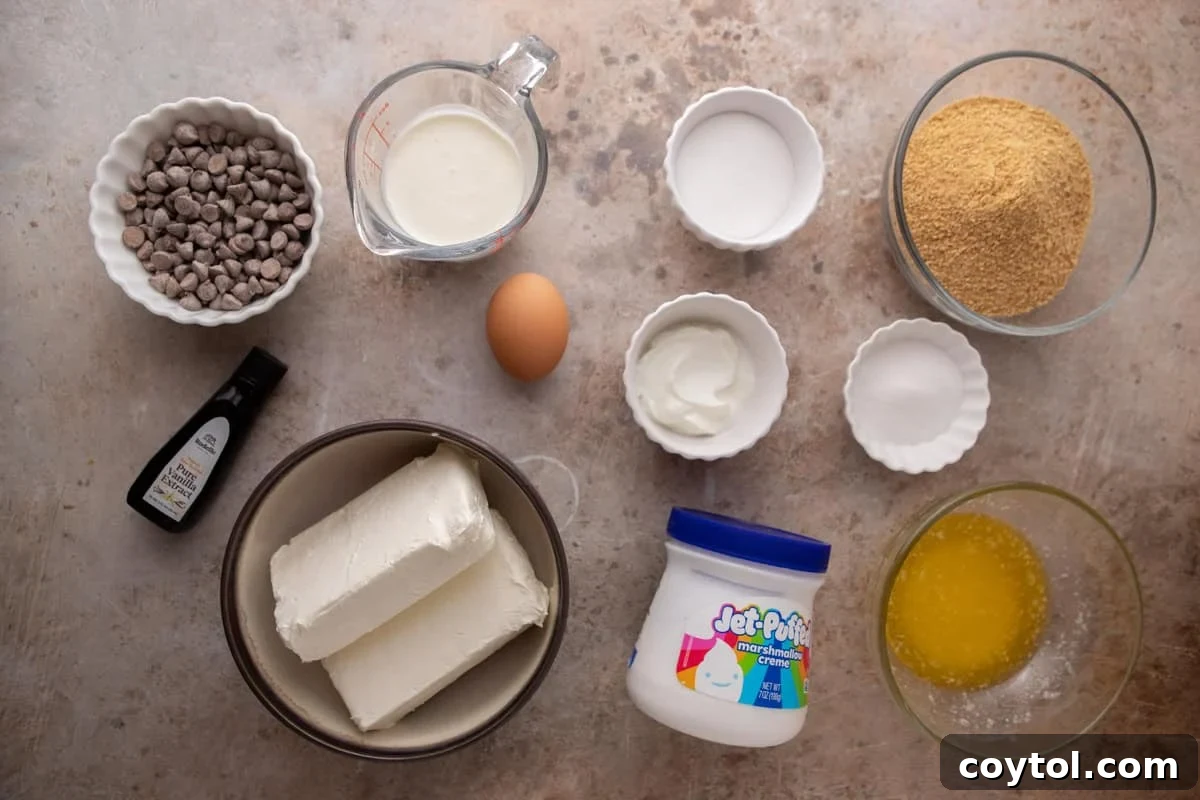 Ingredients including cream cheese, marshmallow fluff, graham crumbs, chocolate, sugar, sour cream, butter, and an egg