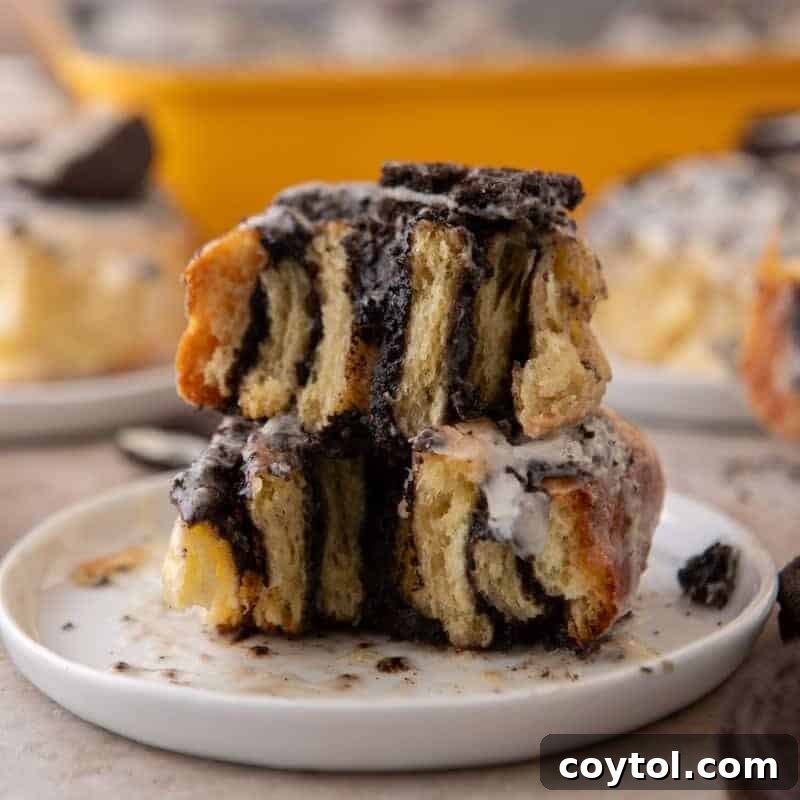 Cross section of Oreo cinnamon rolls stacked showing the filling layers and glaze